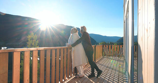 istock Mature couple enjoy hot beverage on deck at sunrise 2221521447