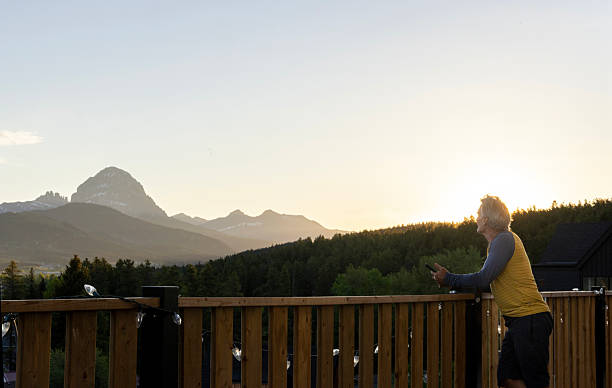 istock Mature man relaxes on deck at sunrise 2221521696
