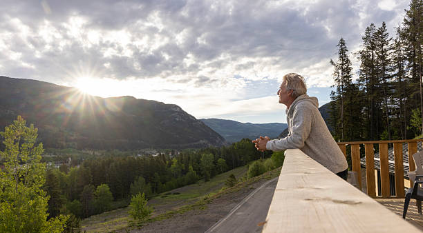 istock Mature man relaxes on deck at sunrise 2221521697