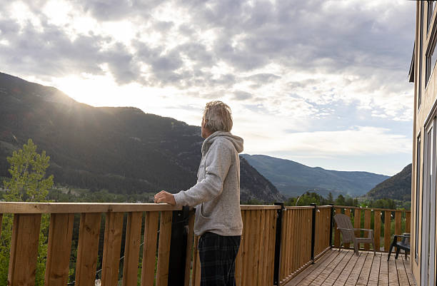 istock Mature man relaxes on deck at sunrise 2221521698