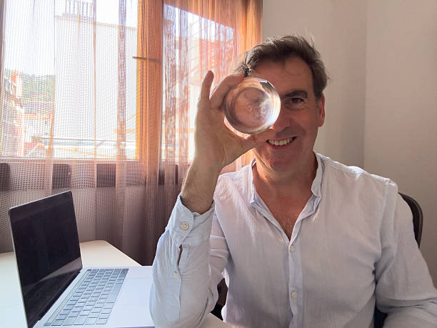 istock Businessman holding crystal ball, predicting future of work 2221525264