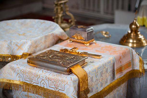 istock Orthodox ritual table with ornate gospel book and religious artifacts 2221526410