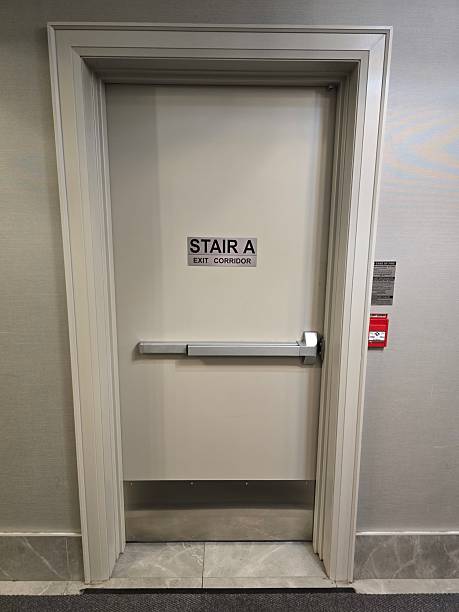 istock Stair A Exit Door in Commercial Building Hallway 2221528554