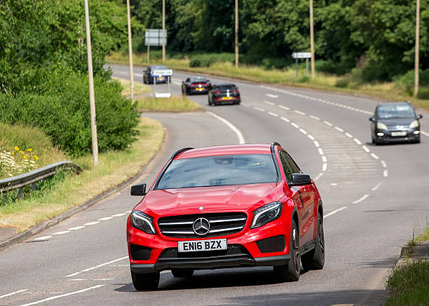Milton Keynes,Bucks,UK - June 22nd 2025:  2016 red Mercedes-Benz gla car driving on a British road
