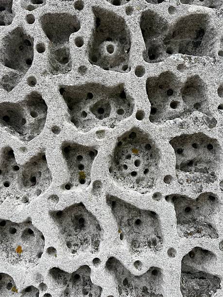 istock Textured grey concrete with holes. 2221535315
