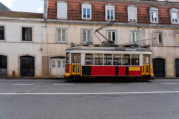 Lisbon Streetcar Amid Colorful Facades Description