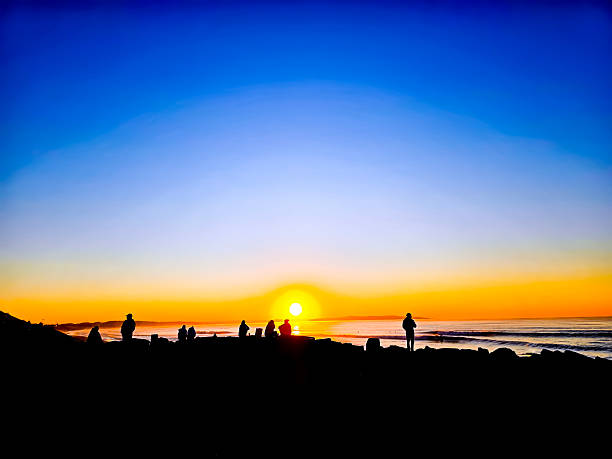 people fishing at sunrise