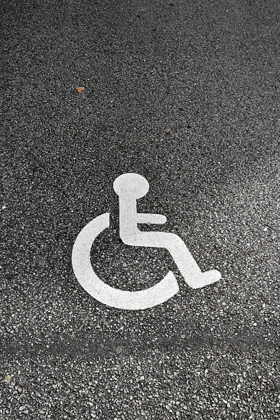 istock Disabled parking sign on asphalt 2221540667