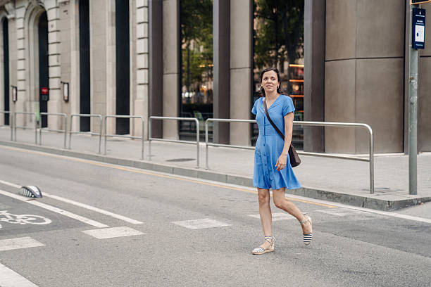 istock Woman walking on a crosswalk 2221542031
