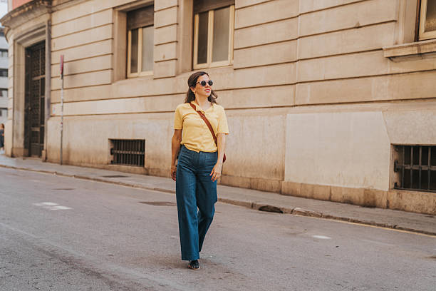 istock Woman walking on a crosswalk 2221542129