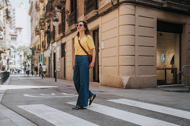 istock Woman walking on a crosswalk 2221542131