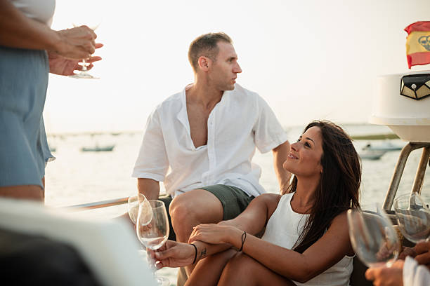 istock Friends enjoying drinks on a boat at sunset in spain 2221553803