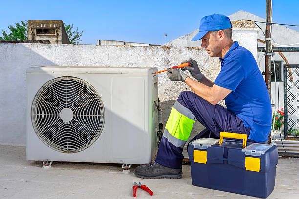 istock Hvac technician performing air conditioner repair service. 2221556380