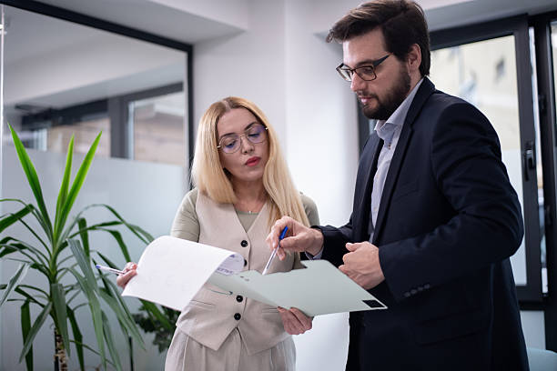 istock Business professionals discuss a project during a meeting in an office setting 2221564433