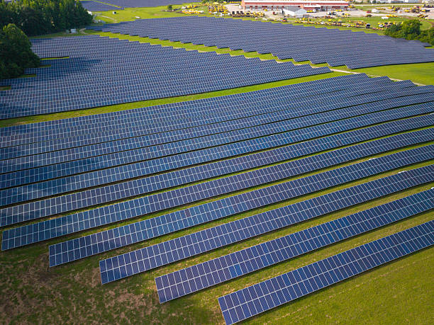 istock Solar Panels in a Field - Wide Shot - Close Up 2221564628