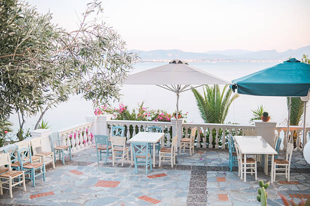 istock Seaside cafe terrace with potted succulents in Greece 2221564862