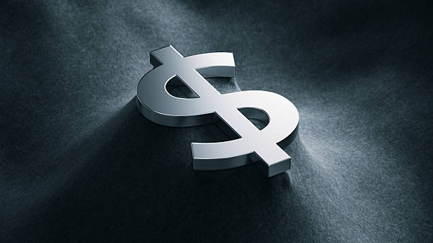 istock 3D illustration Metallic Dollar Sign on Black Luxury Fabric 2221565040
