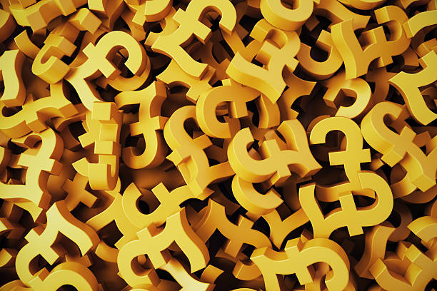 istock Golden Pound Symbols Stacks on Background 2221565353