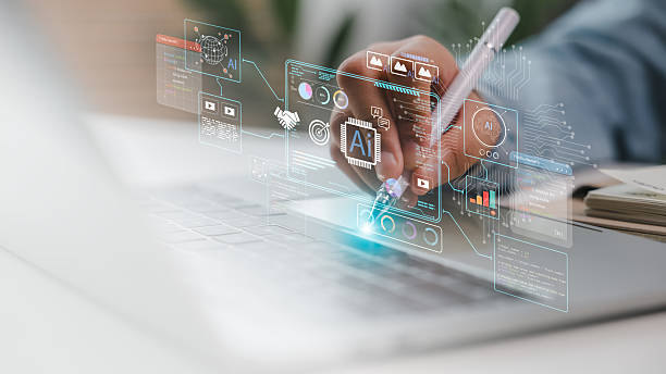 istock Close-up of hand using stylus on laptop with AI interface dashboard. Concept of artificial intelligence development, machine learning, big data visualization, coding, and tech innovation system. 2221566156