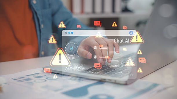 istock Hand typing on laptop with Chat AI warning icons and alert messages. Represents artificial intelligence risks, chatbot error, misinformation, cyber threat, and AI safety concerns. 2221566681