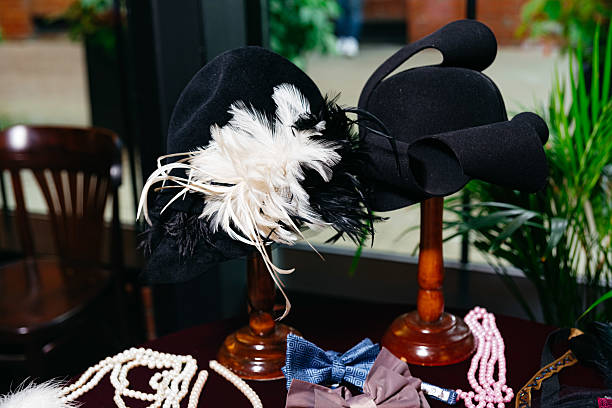 Vintage black hats with feathers and accessories.