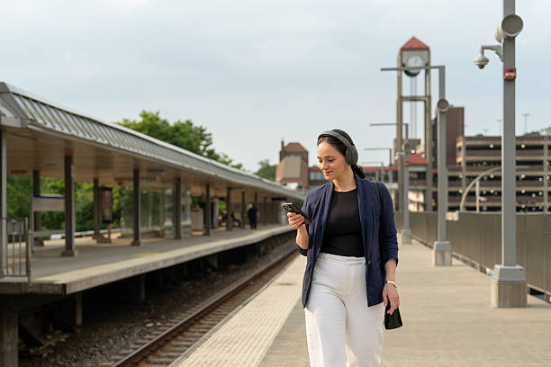 istock Modern woman walking at the train station 2221585091