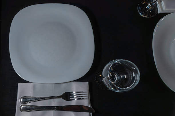 istock Elegant table setting for a gourmet dinner celebration with fine glassware and stylish cutlery in a modern restaurant ambiance 2221593312