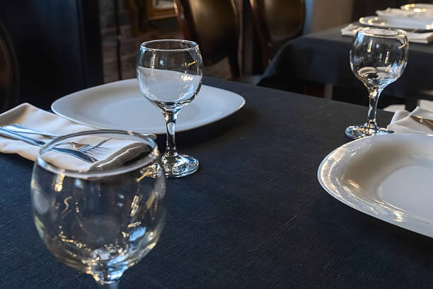 istock Elegant table setting for a gourmet dinner celebration with fine glassware and stylish cutlery in a modern restaurant ambiance 2221593313