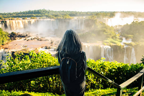 istock Woman watching a waterfall in the Atlantic Forest 2221593399