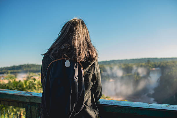 istock Woman in nature with location safety device on backpack 2221593601