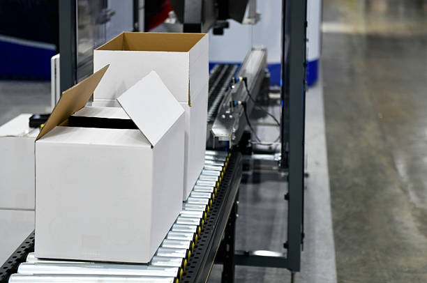 istock Cardboard boxes on conveyor belt. parcels transportation system concept 2221595644