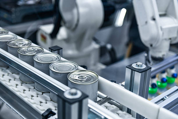 istock Canned food products on conveyor belt in distribution warehouse 2221595708