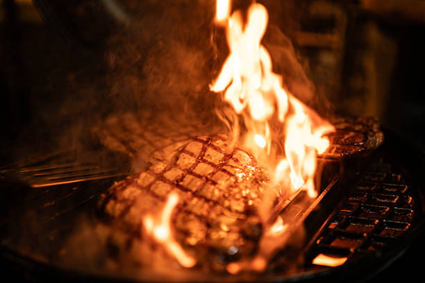 Flaming Grilled Steak Cooking Over Open Flame