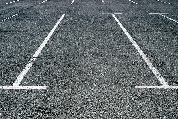istock Empty parking lots with asphalt flooring and white marking lines 2221598378