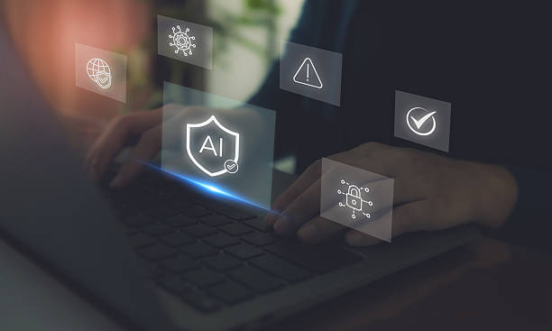 istock AI Cybersecurity Protection Concept. Hands typing on a laptop with digital icons; artificial intelligence, cybersecurity, data protection and warning signals, secure AI technology and online safety. 2221598961
