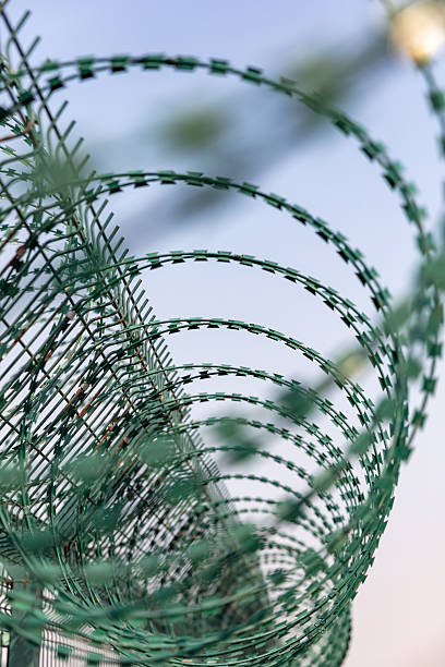 istock Barbed wire used for isolation, blue sky background 2221599067