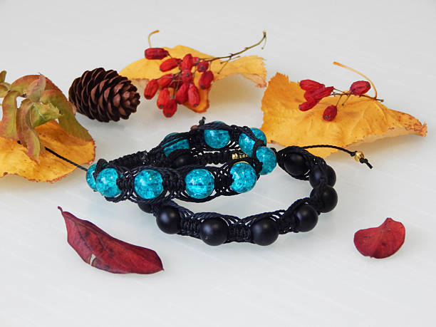 Beautiful friendship colorful bracelets on a white. Hippie bracelets and leafs