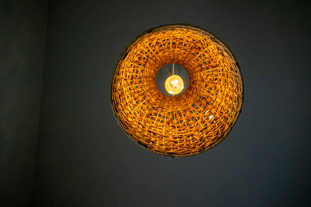 Stunning woven light fixture captures attention with its artistic design, perfect for adding warmth and charm to any interior space.
