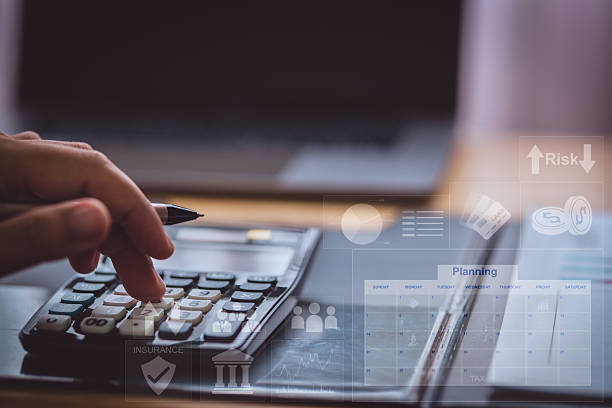 istock A person using a calculator with virtual financial icons, representing business planning, budgeting, accounting, and financial analysis in a modern digital workspace. 2221604504