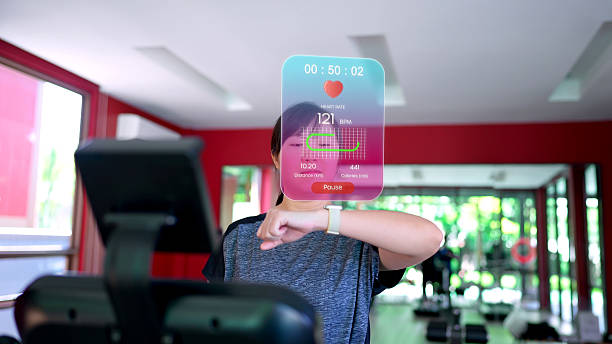 A woman running on a treadmill checks her smartwatch, which projects an augmented reality (AR) display showing real-time fitness data like heart rate, distance, and calories