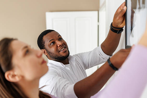 istock Young couple arranging new home 2221605558