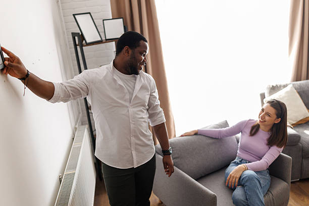 istock Young couple arranging new home 2221607289