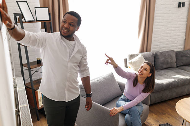 istock Young couple arranging new home 2221607589