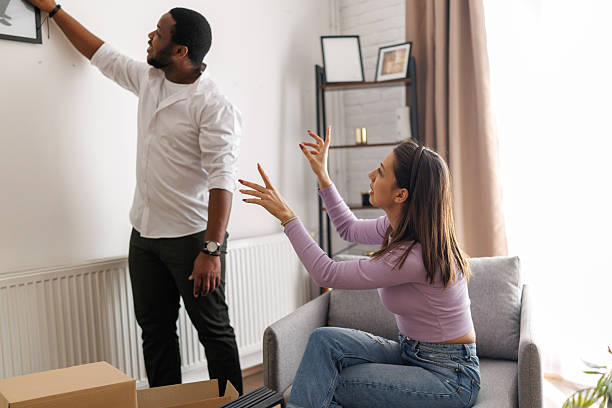 istock Young couple arranging new home 2221607601