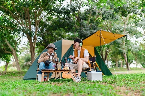 istock Friends Relaxing at Campsite 2221607700