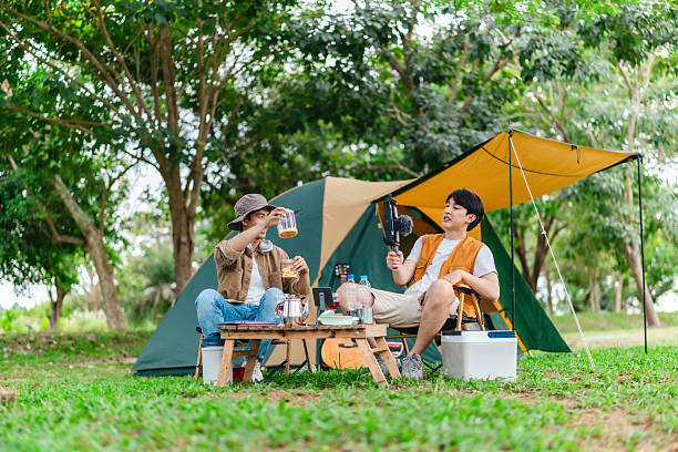 istock Friends Relaxing at Campsite 2221607726