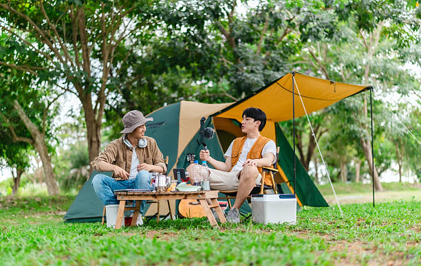 istock Friends Relaxing at Campsite 2221607767