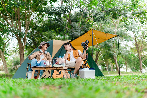 istock Friends Relaxing at Campsite 2221607777