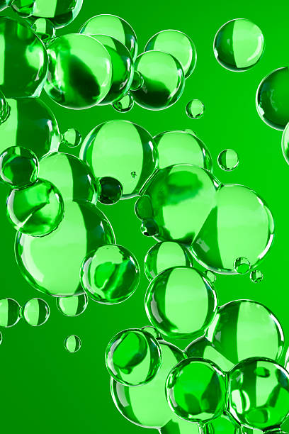 istock Glossy green 3D bubbles floating on a vibrant background. Abstract design symbolizing freshness, nature, energy, or eco-friendly skincare and health concepts. Perfect for science or cosmetics themes. 2221607797