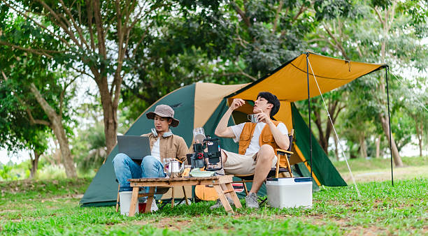 istock Friends Relaxing at Campsite 2221607815